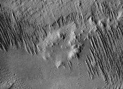 In Gusev Crater winds from the northwest (upper left) have carved soft materials (probably volcanic ash) into long ridges called yardangs. (NASA/JPL-Caltech/Arizona State University)